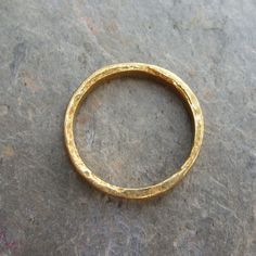 "Twenty-four karat gold has the deepest, brightest color of any form of gold because it's 99.9% pure - in creating each of these solid gold wedding bands, I hope to create a perfect symbol of purity, simplicity, and a seamless union. This ring is intentionally created using the most primitive methods and materials possible. No specialized tools or machining is used in the process aside from a torch and a hammer. Instead of using solder, I join the ends of the ring into a circle by bringing the m Gold Wedding Bands, Solid Gold Band, How To Make Rings, A Perfect Circle, Gold Wedding Band, Pure Gold, Gold Band, Austin Tx, Gold Wedding