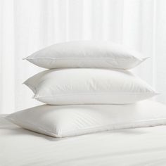 three pillows stacked on top of each other