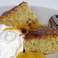 a white plate topped with cake and whipped cream