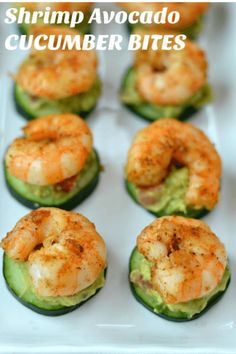 shrimp and avocado stuffed cucumbers on a white platter, ready to be eaten