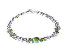 DARK Green Peridot (Olivine) August Birthstone Beaded Bracelets. Not Silver Plated - Not Silver Tone - Not Silver Finished Genuine Solid 925 Sterling Silver Accents on 57 Strand Woven Steel Cable. NO stretchy string or elastic. The sparkle of polished Sterling Silver, the dazzle of genuine Swarovski Crystals! You'll love this simple, classic Birthstone Bracelet - stack-able, well made, and trendy! Sterling Silver Birthstone Bracelet showcases Swarovski Crystals in sparkling simulated Birthstone Nickel-free Green Beaded Bracelets As A Gift, Nickel-free Green Beaded Bracelets For Gift, Nickel-free Green Beaded Bracelet For Gift, Green Nickel-free Beaded Bracelets As A Gift, May Birthstone Spacer Beads Jewelry Gift, Adjustable Green Beaded Bracelets As Birthday Gift, Adjustable Green Beaded Bracelet For Birthday Gift, Adjustable Green Beaded Bracelet For Birthday, Gift Jewelry With Spacer Beads For May Birthstone