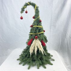 a fake christmas tree with decorations on it