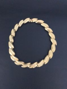 "Spectacular gold tone link necklace. The links has a high polished center with a textured edges. Individually joined so that is lays beautifully on the neck. Secured with a push in slide closure. . The necklace measures approximately 17 inches long. 5/8\" wide. The necklace is signed with A.S. inside a circle. It is in excellent vintage condition Please see this section of my shop for more vintage costume jewelry: https://www.etsy.com/shop/ChrisandTine?section_id=17309162 My full shop: http://w Retro Gold Metal Necklace, Vintage Gold-tone Oval Link Necklace, Retro Gold Metal Chain Necklace, Retro Gold Chain Necklace, Vintage Gold Link Necklaces, Retro Gold Chain Jewelry, Retro Gold Chain Necklace For Formal Occasions, Gold Retro Chain Necklace For Formal Occasions, A Circle