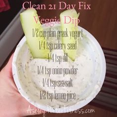 a person is holding a bowl with some food in it and the words clean 2 day fix