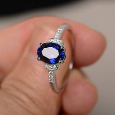 This is a gorgeous handmade creation. Its beauty is its simplicity & Elegance. The 6*8mm oval cut lab sapphire is crafted in solid sterling silver and with rhodium plated. It's made to order and it will take about 7 days to make it. All item is sent in a beautiful gift box You can realize more lovely stuff clicking the link https://www.etsy.com/shop/knightjewelry?refshopsection_shophome_leftnav Please leave the correct address and you phone number for delivering successfully. Oval Sapphire Promise Ring, Oval Lab-created Sapphire Ring, Classic Oval Sapphire Birthstone Ring, Oval Sapphire Ring In Sterling Silver, Oval Sapphire Birthstone Ring, Elegant Sapphire Birthstone Ring In Oval Shape, Silver Oval Sapphire Birthstone Ring, Silver Oval Sapphire Ring, Oval Sapphire Birthstone Ring In White Gold