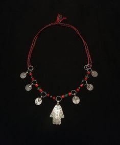 This gorgeous piece has a central silver Amazigh khamsa (Hand of Fatima) inscribed with talismanic symbols hanging on a chain of red, blue and green glass beads with 6 antique silver coin charms (France 1897/ Moroccan 1299 Hijiri) with a  tricolor adjustable cotton cord (35 - 55cm). Simply lovely.  Silver stamped : (Ramshead hallmark) Weight : 29.3 grams Shipping : DHL EXPRESS 🙂 Hippie Necklace, Hand Of Fatima, Statement Ring Silver, Simply Lovely, Silver Coin, Glass Bead Necklace, Star Pendant, Silver Coins, Silver Jewellery