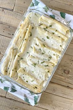 a casserole dish with cheese and herbs