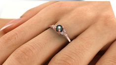 black Pearl Engagement Ring, Pearl Wedding Ring, 14k gold pearl ring, diamond pearl ring, black tahitian pearl rings, Black Pearl Ring black Freshwater Pearl engagement ring with lovely diamonds, set in 14k solid gold. ► FEATURES; Gemstones: Freshwater Pearl: 4- 5mm , Diamond: 4*1mm Total diamond carat weight: 0.03 (Color H; clarity VS) Material options: 14k rose gold, 14k yellow gold, 14k white gold Size: all ring sizes are available How to Order: Please select your preferred size and material Black Pearl Ring Engagement, Black Pearl Wedding Ring, Fine Jewelry Tahitian Pearl For Wedding, Tahitian Pearl Fine Jewelry For Wedding, Tahitian Pearl Wedding Ring Jewelry, Anniversary Black Tahitian Pearl Ring, Black Tahitian Pearl Ring, Tahitian Pearl Wedding Rings In Fine Jewelry Style, Tahitian Pearl Wedding Rings Fine Jewelry