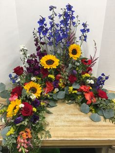 a bunch of flowers that are sitting on a table