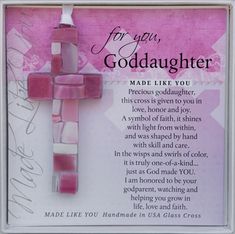 a pink cross with the words for you, god daughter