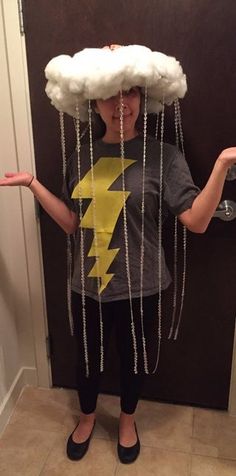 a child wearing a cloud head with lightning on it