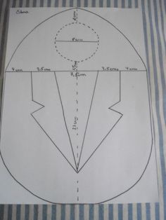 a drawing of a suit on top of a sheet of paper with lines drawn across it