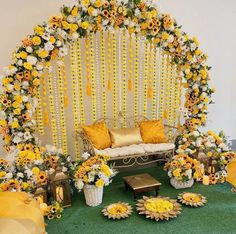 a decorated stage with yellow and white flowers