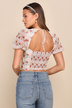 No one will be able to turn away a flawless cutie like you in the Lulus Undeniable Sweetie Ivory Floral Puff Sleeve Tie-Back Bustier Top! Stretchy mesh knit, with a cute floral print throughout, shapes a sweetheart neckline with pleated cups, all framed by short puff sleeves (with elasticized cuffs). The bustier-inspired bodice features a functional hook-and-eye placket that continues down to the cropped hem. A tying detail secures atop a flirty back cutout. Smocking at back for fit. Fit: This g Fitted Smocked Back Crop Top With Short Sleeves, Fitted Short Sleeve Crop Top With Smocked Back, Cute Fitted Spring Blouse, Cute Fitted Blouse For Spring, Fitted White Crop Top With Smocked Back, White Fitted Crop Top With Smocked Back, Cute Fitted Tops For Brunch, Fitted Puff Sleeve Crop Top With Smocked Back, Fitted Crop Top With Smocked Back And Puff Sleeves