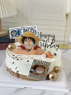 a one piece birthday cake is decorated with an image of the same character on it