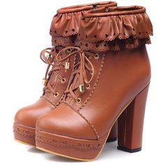 a pair of brown boots with ruffles on the side and heeled heels