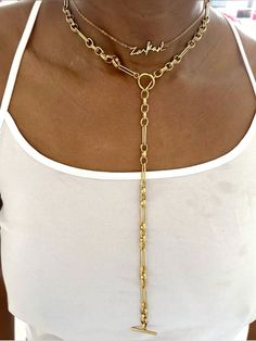 Super trendy luxurious necklace to wear. This necklace is guaranteed to be your favorite piece and will make a perfect gift to a loved one

#longchain #lariatnecklace #longjewelry #giftforher #luxurynecklace #luxuryjewelry #namenecklace #customnecklace Gold Lariat Necklaces With Lobster Clasp, Gold Long Drop Chain Necklaces, Gold Long Drop Chain Necklace, Lariat Choker With Clavicle Chain, Gold Lariat Necklace With Lobster Clasp, Gold Lariat Necklace With Dangle And Lobster Clasp, Gold Lariat Necklace With Dangle, Lariat Clavicle Chain Choker, Clavicle Chain Lariat Choker