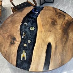 a wooden table with black and white designs on it