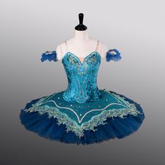 An amazing professional tutu for the role of Sylvia, that can also be used for other variations of the classical repertoire. This stage tutu has been created using different types of fabrics and many shades of blue. The bodice is made with shiny deep sea blue crushed velvet. It is richly decorated with blue matching appliques, trims and rhinestones. The arm bands are made using dark blue tulle. The tutu professional, 10 layers skirt is made with the same shade of dark blue used for the arm bands Recital Themes, Layers Skirt, Ballet Costumes Tutus, Tulle Skirt Tutorial, Ballet Stuff, Dance Recital Costumes, Pancake Tutu, Classical Ballet Tutu, Professional Costumes