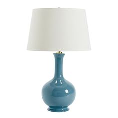 a blue table lamp with a white shade