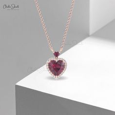 Description Celebrate love with our Dual Heart Necklace, featuring a 1.7 CT Rhodolite embraced by a Halo of Diamonds in 14k Real Gold. Perfect for bridal elegance or a meaningful gift, this necklace symbolizes the unbreakable bond of two hearts intertwined. Product Details SKU CJ N 1833 RG Metal 14K Solid Gold Chain type Cable Chain Chain length 14+2 inch Closing mechanism Spring Ring Product dimension 16 inch Birthstone January Certification N/A Rhodolite Garnet Details 1 Stone size 3mm Quality Hearts Intertwined, Bridal Elegance, Solid Gold Chains, Rhodolite Garnet, Stone Setting, Two Hearts, Bridal Necklace, 1 Carat, Real Gold