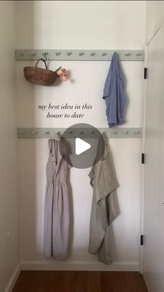 a coat rack with clothes hanging on it and the words my best idea in this house to date