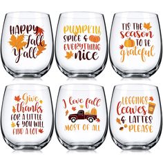 six wine glasses with autumn sayings on them, including pumpkins and fall leaves