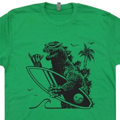 Godzilla Surf Shirt | Retro Surfing T Shirt | Cool Vintage Surfing Shirt – Shirtstash Surf T Shirts, Vintage Surfing, Surf Vintage, Surf Shirt, Surf Tshirt, Vintage Surf, Graphic Tees Vintage, Bella Canvas Tees, Green Tshirt