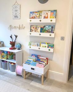 a child's room with bookshelves and toys