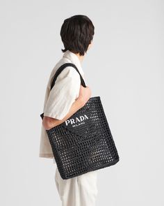 Find PRADA Crochet Tote Bag With Logo on Editorialist. Raffia-effect yarn Crochet workmanship Flat raffia handles Prada Milano logo on the front Unlined Prada Crochet Bag Outfit, Crochet Prada Bag Pattern, Luxury Black Crochet Tote Bag, Prada Raffia Bag, Prada Milano Crochet Bag, Prada Milano, Prada Tote Bag, Embroidered Tote Bag, Embroidered Tote