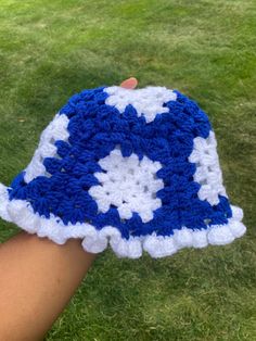 Blue and white crochet bucket hat with ruffles! Part of the D9 Inspired Collection. This hat is perfect for tailgates, darties, and your blue and white fits! Blue Crochet Bucket Hat For Spring, Blue Crochet Bucket Hat For The Beach, Blue Yarn Bucket Hat For Spring, Blue Crochet Adjustable Bucket Hat, White Crochet Brimmed Bucket Hat, Adjustable Crochet Blue Bucket Hat, Adjustable White Hat With Ruffles, Adjustable Blue Crochet Bucket Hat, Adjustable White Ruffled Hat