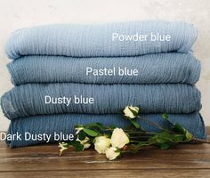 four blue towels stacked on top of each other with the words powder blue, pastel blue, dusty blue and dark dusty blue