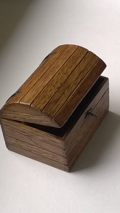 two wooden boxes sitting on top of each other