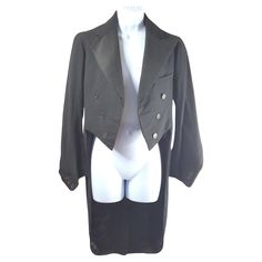 This antique ArtDeco-period bespoke British wool and satin black tuxedo button-decorated open-breasted tailcoat fits a women's U.S.-size 6 so well that we think it was custom-made for one. A hidden printed label identifies the couture craftsman as Harry Kay at Windsor Place, which remains one of the most sought after professional locations in the heart of Cardiff, the capital of Wales. Amusingly, it includes the very early phone number for his business of only four digits, which was the standard Elegant Wear, Josephine Baker, Formal Mens Fashion, Marlene Dietrich, Couture Mode, Black Tuxedo, Tuxedo Jacket, John Galliano, The Capital