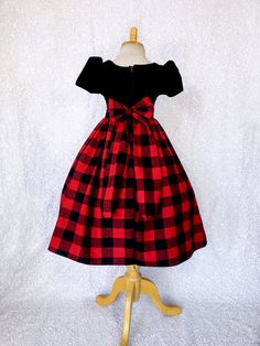 An elegant dress that's perfect for any occasion: wedding, christmas, birthday, or pageant! This dress is made out of a comfortable cotton plaid bottom and velvet top. The top comes with short sleeves and a zipper on the back. Attached to the waist are two strips of plaid fabric that can be used to tie together into a bow at the back for a comfortable and snug fit. The plaid skirt has a layer of layer of lining with crinoline attached to give the skirt some fullness. *Mannequin has petticoat to Gown Birthday, Cotton Gowns, Holiday Dress Outfit, Wedding Flower Girl, Velvet Top, Wedding Christmas, Holiday Dress, Plaid Fabric, Capped Sleeve Dress