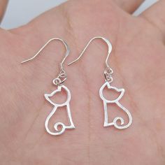 (1)Metal Material: sterling silver (2)Cat Size: length 18.5mm, width 10mm (3)Ear Wire Size: length 14mm, width 13mm (4)Package: in a bubble emailer For more earring, please find here: https://www.etsy.com/shop/LBCreatives?ref=seller-platform-mcnav&section_id=32032126 Silver Cat Design Dangle Earrings, Silver Cat Design Jewelry With Cat Ears, Sterling Silver Cat Design Earrings For Gift, Hypoallergenic Silver Cat Ears Jewelry, Silver Cat Design Drop Earrings, Silver Drop Earrings With Cat Design, Elegant Silver Cat Design Earrings, Silver Cat Ears Jewelry, Hypoallergenic Silver Cat Ears Earrings