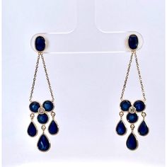 I just love these earrings.  They are made up in 18K Yellow Gold and feature round, oval and pear cut Sapphires totally 7.21 Carats round and brilliant Diamonds approx. 0.12 carats H-I VS.  These are mini Chandelier earrings and measure 1 3/4" long and weighs 3.57 grams. You can wear these with everything as they are truly spectacular but doesn't overpower anything else you may be wearing. These Sapphires are eye clean and a beautiful color of true Sapphire Blue.  They also do not tangle as many do, they hang nicely and you will receive many compliments on these beautiful earrings.  Do not wait, they will be gone. Elegant Teardrop Diamond Earrings Fine Jewelry, Teardrop Diamond Earrings With Elegant Design, Elegant Yellow Gold Drop Diamond Earrings, Luxury Yellow Gold Teardrop Chandelier Earrings, Formal Sapphire Dangle Diamond Earrings, Elegant Oval Diamond Earrings For Formal Occasions, Formal Yellow Gold Diamond Chandelier Earrings, Oval Diamond Earrings With Elegant Design For Formal Occasions, Luxury Yellow Gold Drop Chandelier Earrings