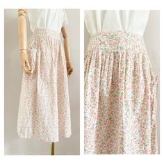 "Cute 70s Cacharel midiskirt Made from a cotton liberty printed floral fabric Closes at the back with a zipper The skirt has pocket at the side UK Size: 6-8 (xs-s), US: 4-6, EU: 34-36 Waist: 33,5 cm - 13,2\" Length: 72 cm - 28,4 \" Material: 100% cotton In perfect condition This item has been washed and steamed so that there are no more odors. This item is vintage, which means 25 years or older. Small flaws are not uncommon, but we do our best to mention them in the description Return Policy: It Feminine Cotton Floral Print Skirt, Spring Cotton Peasant Skirt, Peasant Cotton Skirt For Spring, Cotton Peasant Skirt For Spring, Cotton Floral Print Skirt For Garden Party, Cottagecore Cotton Skirt For Summer, Vintage Cotton Floral Print Skirt, Vintage Cotton Skirt With Floral Print, Bohemian Cotton Skirt For Garden Party