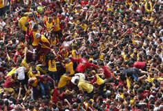 a large group of people standing next to each other in the middle of a crowd