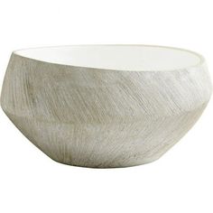 a white bowl sitting on top of a table