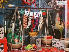 an assortment of items displayed in front of a store window with the year 2012 on it