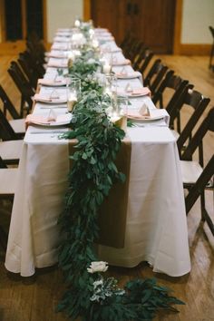 the table is set up with place settings for guests to sit down and enjoy their meal