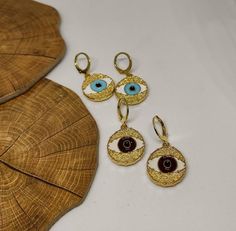 hoop earringsgold hoop earringsdangle earringshuggie hoop earringsclip on earringsgold evil eyeevil eye earringsgold earringsdrop earringsgift for hervintage earringsstatement earringseye earringsGold evil eye hoop earringsThis cute earrings are made from steell and they are 24k gold plated and handpainted.You can choose between 4 different clasps (the numbers 1 and 2 are for non pierced ears)They are very light and comfortable!Plus they are anti allergic/ nickel free ❤Evil eye meaningThe evil e Trendy Handmade Gold Plated Jewelry, Adjustable Gold Evil Eye Earrings, Eye-catching Dangle Jewelry For Gifts, Yellow Gold Evil Eye Jewelry, Evil Eye Round Earrings For Gift, Gold Evil Eye Earrings As Gift, Gold Evil Eye Drop Earrings, Brass Huggie Earrings For Gift, Brass Huggie Earrings As Gift