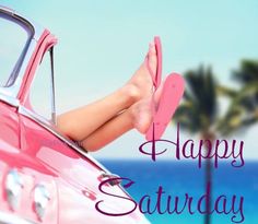 a woman's feet sticking out of the side of a pink car with palm trees in the background