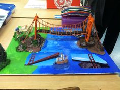 this is a model of a bridge with boats on it