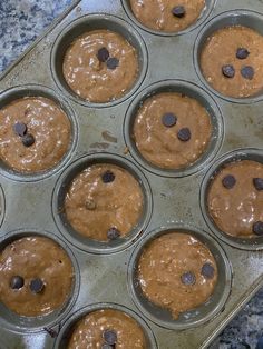 chocolate chip muffins in a pan ready to be baked