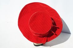 "Vintage Women's Hat Chapeau Asymmetrical Brimmed Red Velvet Mid Century Rockabilly Church Style Bridal Accessory Christmas Hat. There is nothing better than anything red Here's a great example! A beautiful ruby red, velvet hat. The brim is larger in front. Quilting details on the large, wired, front brim and top of the hat. 2 bands of velvet ribbon bows around crown of the hat. No makers markings. It measures approximately 19 1/2\" around inside band. In great condition! Very clean! The crown i Adjustable Red Hats For Holiday, Adjustable Red Hat For Holiday, Retro Red Party Hat, Artisan Red Hat With Curved Brim, Red Retro Party Hat, Handmade Red Hat With Curved Brim, Elegant Red Hat With Curved Brim, Retro Red Hat With Curved Brim, Red Vintage Costume Hat