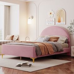 a pink bed sitting on top of a hard wood floor next to a window with curtains