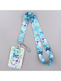 a blue lanyard with butterflies on it and a tag attached to the lanyard