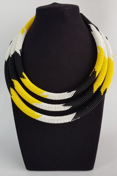 This necklace is 100% handcrafted using original fine beads. Perfect for African themed events and weddings. **Buy multiple items and pay shipping for ONE item only. More neckleces here; https://www.etsy.com/shop/TribalTess?ref=seller-platform-mcnav&section_id=21306083 Back to my shop; https://www.etsy.com/shop/TribalTess?ref=seller-platform-mcnav Multi-strand Polished Beads Necklace As Gift, Multi-strand Necklace With Polished Beads For Gifts, Multi-strand Necklaces With Polished Beads As Gift, Yellow Beaded Necklaces With Faceted Beads For Gift, Yellow Faceted Beads Necklace As Gift, Yellow Faceted Beads Necklace For Gift, Traditional Yellow Necklaces With Faceted Beads, Yellow Polished Beads For Gifts, Yellow Single Strand Beads For Gifts